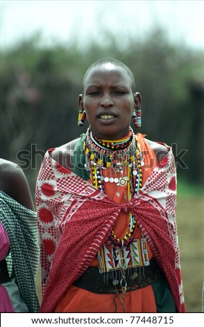MAASAI MARA, KENYA - FEBRUARY 4: Maasai woman in the village, 4 February , 2004 at Masaai Mara, Kenya. The Maasai are the most famous tribe in Africa. They are nomadic and live in small villages.