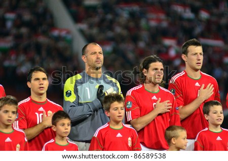 BUDAPEST, HUNGARY - OCTOBER 11 : Hungarian national football team during the national anthem at Hungary - Finland European Cup qualifier football match at October 11, 2011 in Budapest, Hungary. Unidentified kids