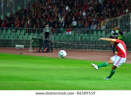 BUDAPEST, HUNGARY - OCTOBER 11 : Hungarian international Tamas Hajnal shoots a free kick at Hungary - Finland European Cup qualifier football match at October 11, 2011 in Budapest, Hungary.