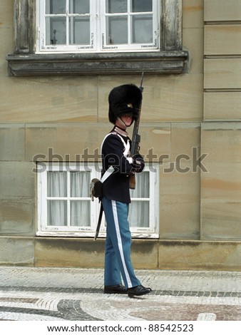 COPENHAGEN, DENMARK - MAY 19 : Royal guard at Amalienborg Slot at May 19, 2001 in Copenhagen, Denmark. This palace is the home of the Danish royal family and a top tourist attraction as well.