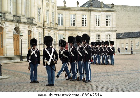 COPENHAGEN, DENMARK - MAY 19 : Royal guards at Amalienborg Slot at May 19, 2001 in Copenhagen, Denmark. This palace is the home of the Danish royal family and a top tourist attraction as well.