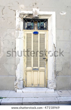 faded shuttered french doors