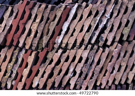 Pattern of multi coloured ends of victorian roofing tiles
