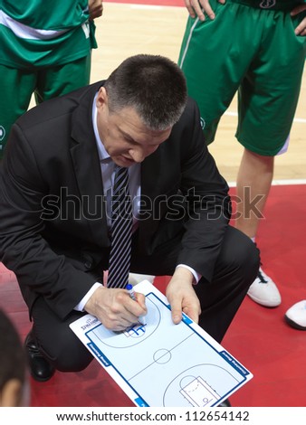 SAMARA, RUSSIA - MARCH 10: Time out. Coach of BC UNICS Eugene Pashutin says the game plan against BC Krasnye Krylia on March 10, 2012 in Samara, Russia.