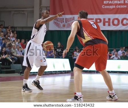 SAMARA, RUSSIA - MAY 11: Aaron Marquez Miles of BC Krasnye Krylia with ball goes against a BC Ural player on May 11, 2012 in Samara, Russia.