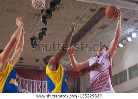 SAMARA, RUSSIA - OCTOBER 22: Dmitriy Kulagin of BC Krasnye Krylia with ball attacks a basket during a BC Astana game on October 22, 2012 in Samara, Russia.