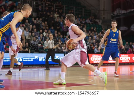 SAMARA, RUSSIA - DECEMBER 17: Dmitriy Kulagin of BC Krasnye Krylia, with ball, is on the attack during a BC Khimki game on December 17, 2012 in Samara, Russia.