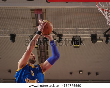 SAMARA, RUSSIA - DECEMBER 17: James Augustine of BC Khimki throws a ball in a basket during a game against BC Krasnye Krylia game on December 17, 2012 in Samara, Russia.