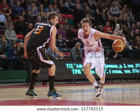 SAMARA, RUSSIA - JANUARY 15: Dmitry Kulagin of BC Krasnye Krylia, with ball, is on the attack during a BC Norrkoping Dolphins game on January 15, 2012 in Samara, Russia.