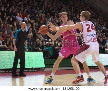 SAMARA, RUSSIA - MARCH 12: Fabian Thulig of BC Telekom Baskets Bonn with ball tries to go past a BC Krasnye Krylia player on March 12, 2013 in Samara, Russia.