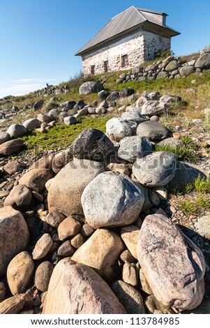 Stone house on the rocky shore. Bolshoi Zayatsky Island, Solovetsky Islands, The White Sea, Karelia, Russia.