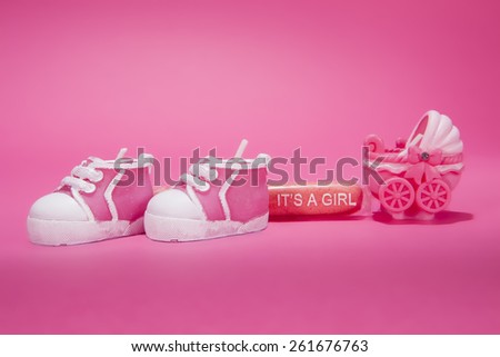 A birth announcement against a pink background