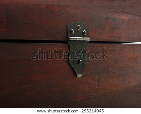 Old wooden chest with metal lock. Close up