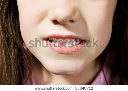 Small girl toothless smile close up
