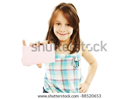 Gift card sign little girl. Excited little girl showing empty blank paper note copy space. Isolated on white background