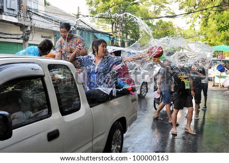 BANGKOK - APR 13: Revellers celebrate Songkran, the Thai new year, by throwing water on Apr 13, 2012 in Bangkok, Thailand. Traditionally the new year is brought in with large scale water fighters.