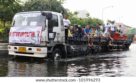 BANGKOK - NOV 4: A lorry navigates a flooded road in Pinklao district in rescuing flood victims as Thailand faces its worst flooding in 50 years on Nov 4, 2011 in Bangkok, Thailand.