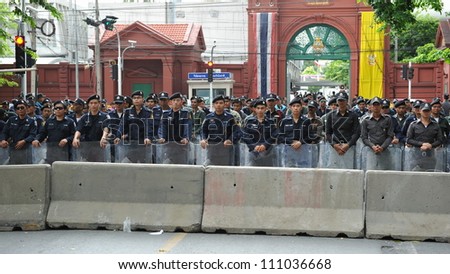 BANGKOK - MAY 31: Riot police form a line outside Thai Parliament during a political rally on May 31, 2012 in Bangkok, Thailand. Protesters rallied in opposition to a proposed reconciliation bill.