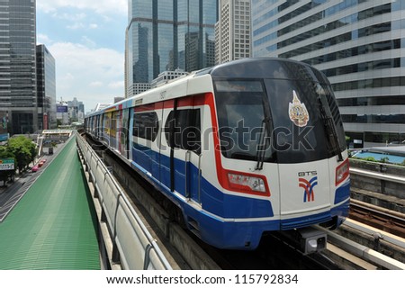 BANGKOK - SEPT 12: A BTS Skytrain on elevated rails in Sathorn district on Sept 12, 2012 in Bangkok, Thailand. Each train of the mass transport rail network can carry over 1,000 passengers.