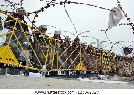 BANGKOK - NOV 24: Riot police stand guard on Makhawan Bridge during a violent anti-government rally on Nov 24, 2012 in Bangkok, Thailand. Protesters and police clashed repeatedly with dozens injured.