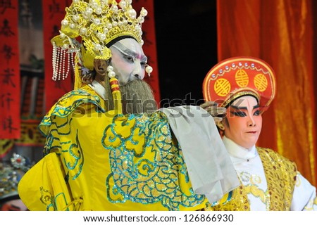 BANGKOK - JAN 14: An unidentifed actor appears in a public showing of Chinese street opera in Banglampu district on Jan 14, 2013. Chinese opera orginated in the Tang dynasty cira 720 AD.