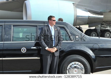 BANGKOK - NOV 18: An unidentified body guards waits by the Presidential State Car at Don Muang Airport as President Barack Obama begins a historic SE Asia tour on Nov 18, 2012 in Bangkok, Thailand.