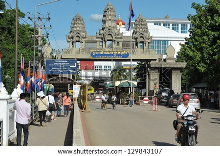 POIPET - JULY 10: People cross the border between Thailand and Cambodia on July 10, 2012. Border town Poipet is a renowned destination for casinos, where in neighbouring Thailand gambling is illegal.