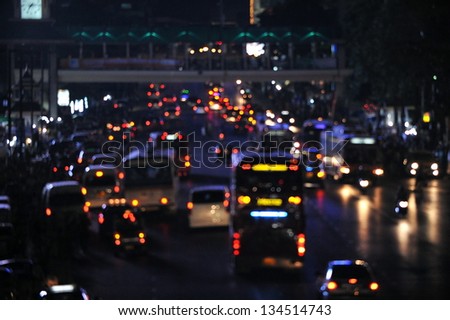 Defocused Lights of Heavy Traffic on a City Road at Night
