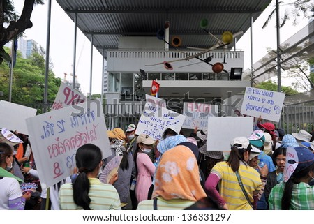 BANGKOK - MARCH 13: Thai NXP workers protest infront of the Royal Netherlands Embassy on March 13, 2013 in Bangkok, Thailand. Union workers gathered to request better wages and work conditions.
