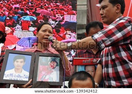 BANGKOK - MAY 19: Relatives of red shirts killed in anti-government clashes join a large rally on May 19, 2013 in Bangkok, Thailand. Red shirts gathered in remembrance of those killed in protests.