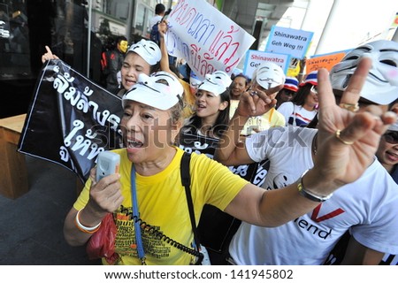 BANGKOK - JUNE 9: A protest leader direct an anti-government rally in Bangkok\'s shopping district on June 9, 2013 in Bangkok, Thailand. The protesters called for the government to be overthrown.