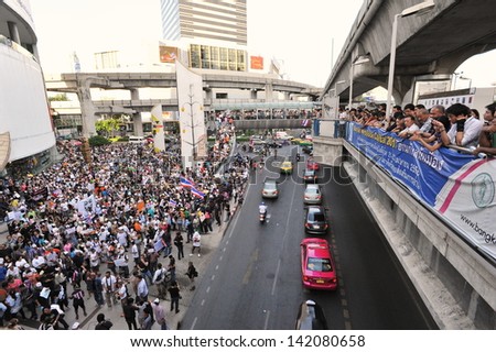BANGKOK - JUN 9: A protester joins an anti-government rally in Bangkok\'s shopping district on Jun 9, 2013 in Bangkok, Thailand. The protesters call for the government to be overthrown.