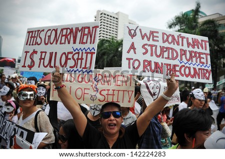BANGKOK - JUN 2: Anti-government protesters rally in Bangkok\'s shopping district on Jun 2, 2013 in Bangkok, Thailand. The protesters are calling for the government to be overthrown.
