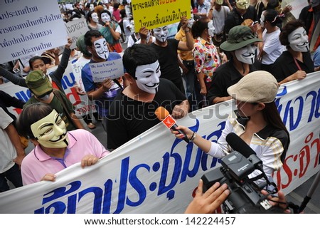BANGKOK - JUN 2: Protesters wearing Guy Fawkes masks give an interview to media at an anti-government rally in Bangkok\'s shopping district on Jun 2, 2013 in Bangkok, Thailand.