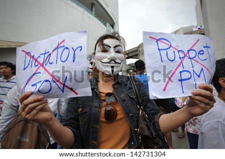 BANGKOK - JUNE 16: A protesters wearing a Guy Fawkes mask joins a large anti-government rally in Bangkok\'s shopping district on June 16, 2013 in Bangkok, Thailand.