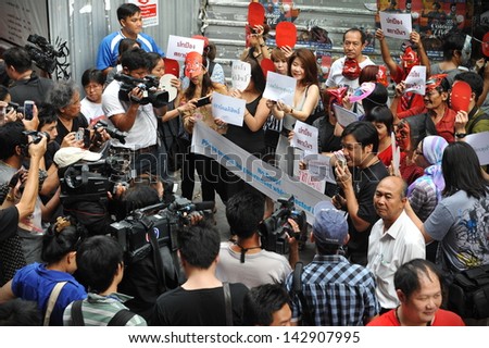 BANGKOK - JUNE 2: Red Shirts stage a rally in support of the government in Bangkok\'s shopping district on June 2, 2013 in Bangkok, Thailand.