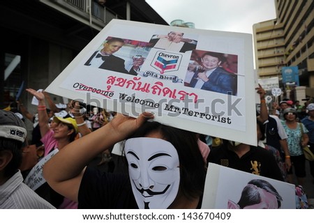 BANGKOK - JUNE 16: A protesters wearing a Guy Fawkes mask joins a large anti-government rally in Bangkok's shopping district on June 16, 2013 in Bangkok, Thailand.
