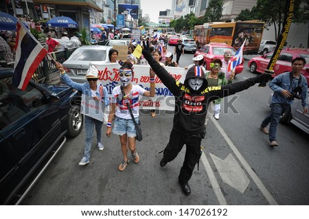 BANGKOK - JULY 21: Protesters hold an anti-government rally in Bangkok\'s shopping district on July 21, 2013 in Bangkok, Thailand. The protesters call for the government to be overthrown.