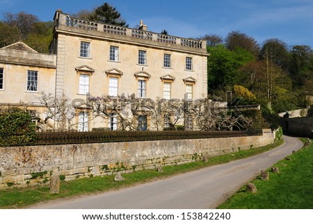 Beautiful Old English Manor House on a Country Road in Rural England
