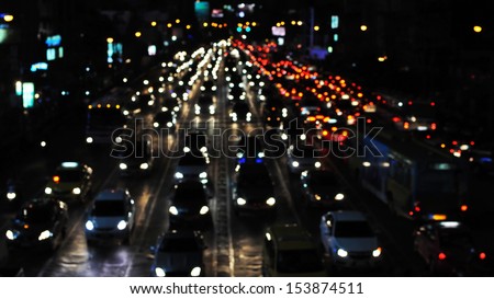 Defocused Lights of Gridlocked Traffic on a Busy City Road at Night