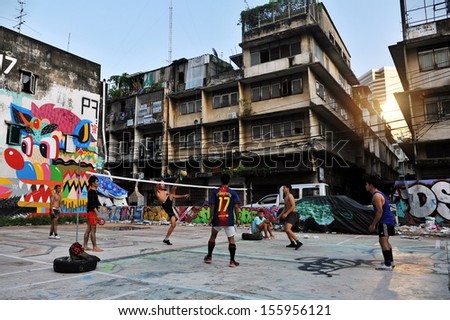 BANGKOK - MAY 27: Takraw players hold an informal street match on derelict land on May 27, 2013 in Bangkok, Thailand. Takraw or Kick Volleyball is a popular activity with youth in the Thai capital.