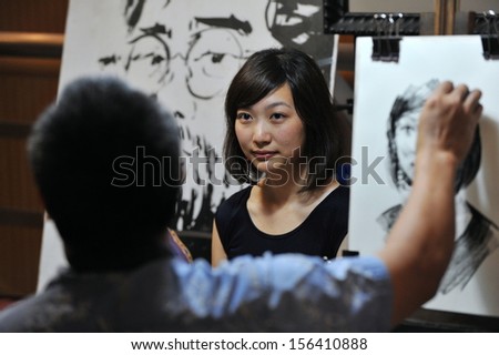 Bangkok - Jun 30: An Unidentified Woman Is Sketched By An Artist At The Bangkok Art And Cultural Centre (Bacc) On Jun 30, 2013 In Bangkok, Thailand. Opened In 2010 Bacc Is Home To Many Art Studios.