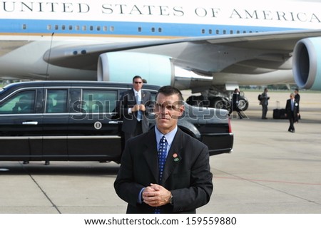 Bangkok - Nov 18: An Unidentified Body Guards Waits By The Presidential State Car And Air Force One At An Airport As President Barack Obama Begins A Se Asia Tour On Nov 18, 2012 In Bangkok, Thailand.