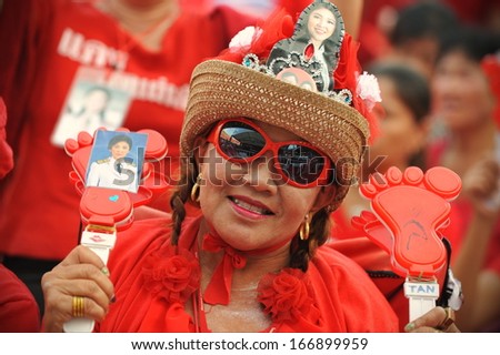 BANGKOK - NOV 30: Red Shirt supporters rally in support of the government on Nov 30, 2013 in Bangkok, Thailand. Thousands showed support, while daily anti-government rallies take place in the capital.