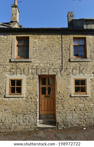Exterior View of an Old English Stone Cottage