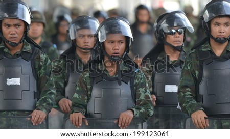 BANGKOK - MAY 31: Thai soldiers in riot gear secure a shopping district in preventing anti-coup protests on May 31, 2014 in Bangkok, Thailand. Thailand is experiencing its 19th military coup.