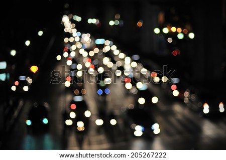 Defocused Vehicles Lights on a Busy City Road at Night