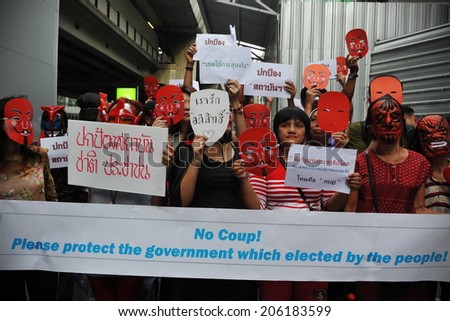 BANGKOK - JUNE 2: Red Shirts stage a rally in support of the government in Bangkok\'s shopping district to counter a large anti government rally earlier in the day on June 2, 2013 in Bangkok, Thailand.