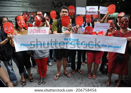BANGKOK - JUNE 2: Red Shirts stage a rally in support of the government in Bangkok\'s shopping district to counter a large anti government rally earlier in the day on June 2, 2013 in Bangkok, Thailand.