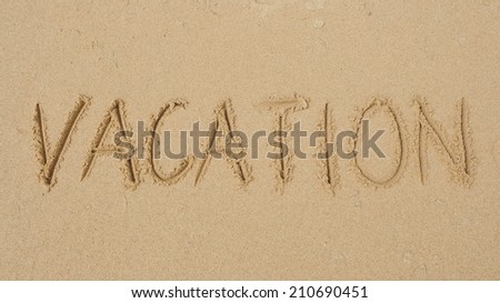 The Word \'Vacation\' Written in Sand Background